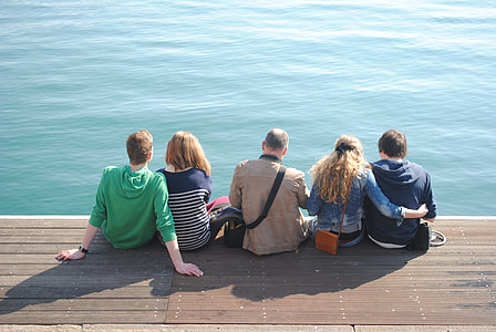 Group Sitting By Water, People By Water thumbnail