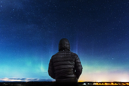 man in black puffer hoodie wallpaper thumbnail