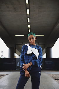 woman standing on concrete pavement thumbnail