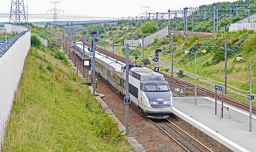 white bullet train on rail road thumbnail