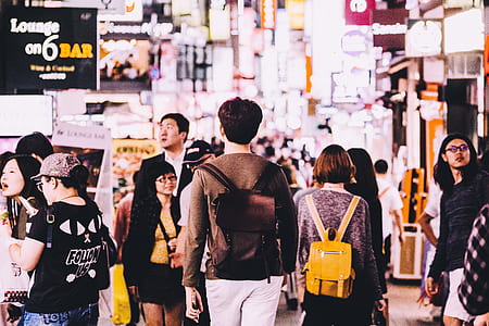 mass of people walking near road thumbnail