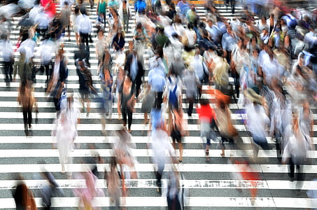 panning photography of group of people on pedestrian lane thumbnail