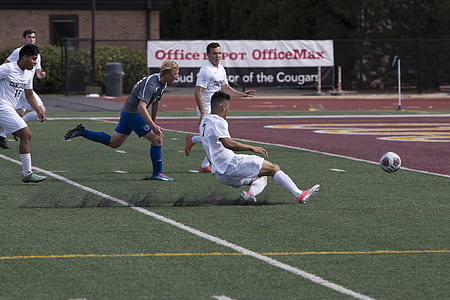 several soccer players chasing the ball thumbnail