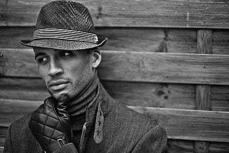 Man Wearing Black Hat and Gloves thumbnail