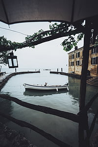 empty boat near building thumbnail
