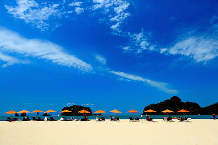 group of peoples on beach in front of islands \ thumbnail