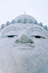 photo of gray Buddha's head during daytime thumbnail