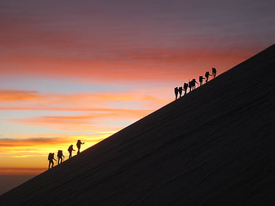 silhouette photo of hikers with background of sunset thumbnail