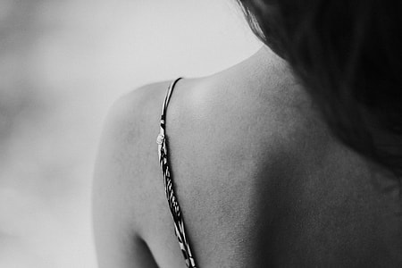 Woman in a dress with a camera thumbnail