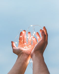 person holding string lights during daytime thumbnail