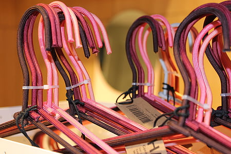 pink, black, and red clothes hangers thumbnail