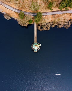 aerial view of dock with body of water during daytime thumbnail