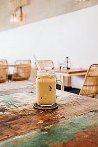 photo of clear glass mug with dessert on table thumbnail