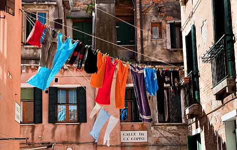 clothes hanged between buildings thumbnail