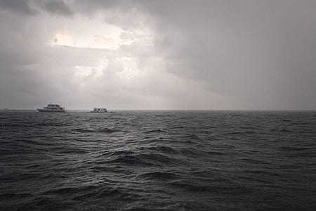 person showing body of water in grayscale photography thumbnail