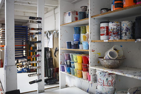 white wooden shelf with paint cans thumbnail