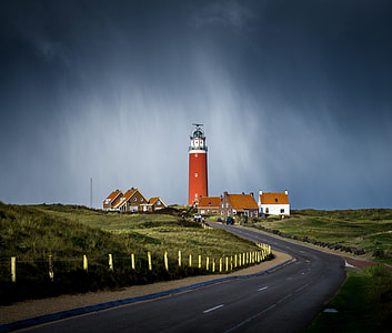 photo of roadway into lighthouse during daytime thumbnail
