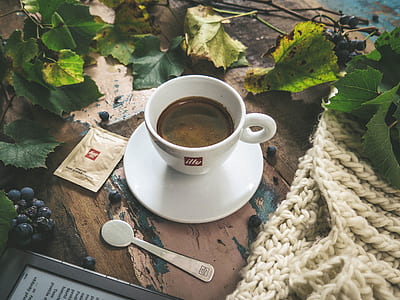 White Ceramic Tea Cup With Coffee Inside thumbnail