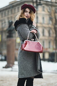 Selective Focus Photography Woman Wearing Gray Coat Standing Near Building thumbnail