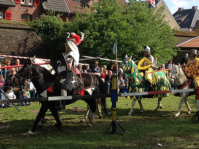 Knight riding on horse at medieval festival thumbnail