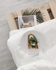 White Ceramic Plate on White Textile thumbnail