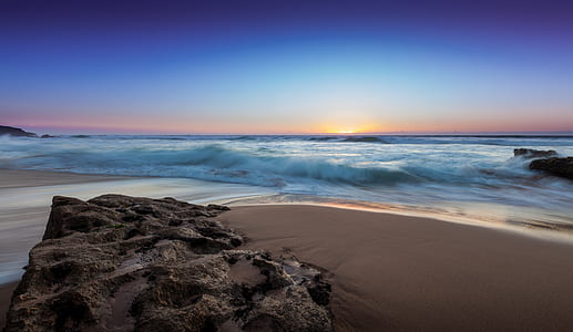 rock formation on seashore during daytime thumbnail