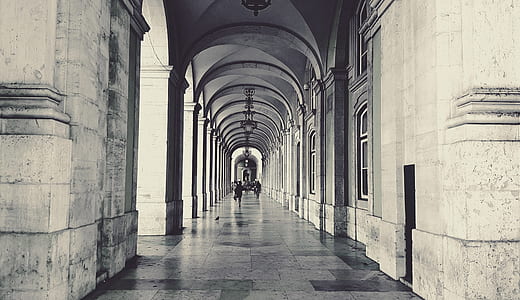 grayscale photography of people walking on alley thumbnail