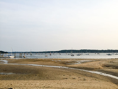 boat on body of water near seashore thumbnail