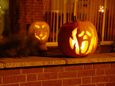lighted Jack-O-Lanterns on brick wall thumbnail