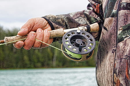 person holding fishing rod thumbnail