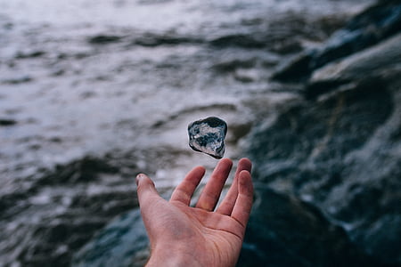 person about to throw stone thumbnail