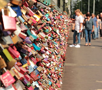 piled padlock on wall thumbnail