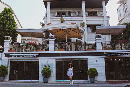 Woman Standing in Front of Restaurant thumbnail
