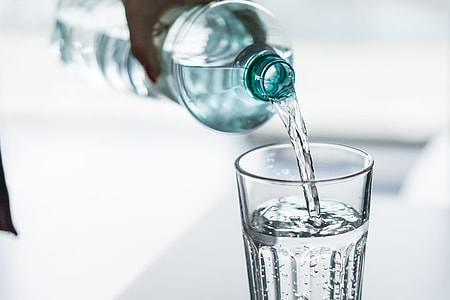 Pouring Water from PET Bottle into a Glass thumbnail