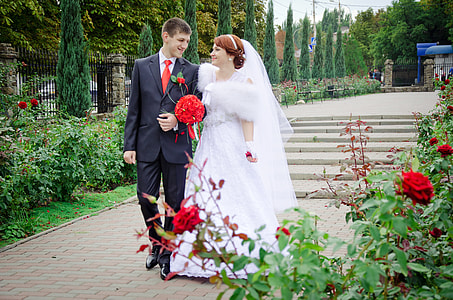 man and woman walking down the garden thumbnail