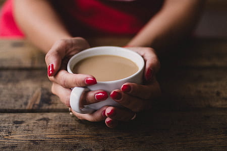 Women Holding Cup Of Coffee thumbnail