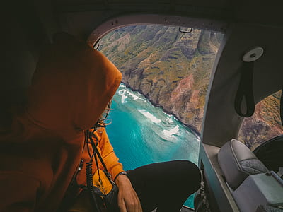 person wearing orange hoodie thumbnail