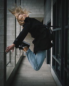 woman jumping on the hallway thumbnail