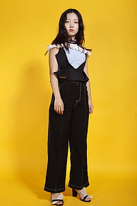 woman in black top and jeans thumbnail