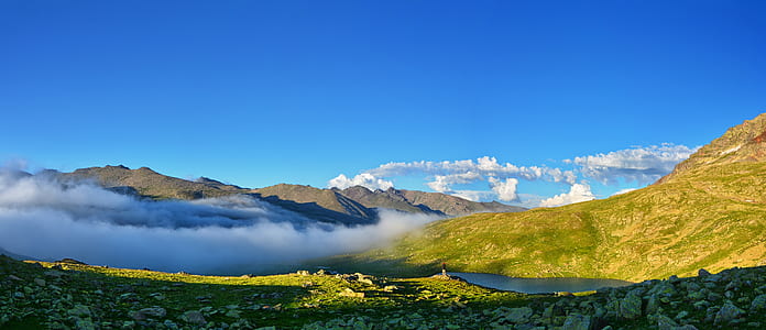 mountain range under clear blue sky thumbnail
