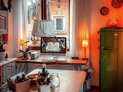 wooden table near refrigerator inside kitchen thumbnail