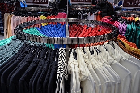 assorted-color clothes on steel rack thumbnail