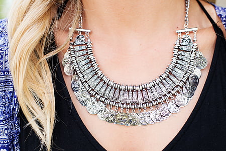 woman wearing silver-colored collar necklace thumbnail