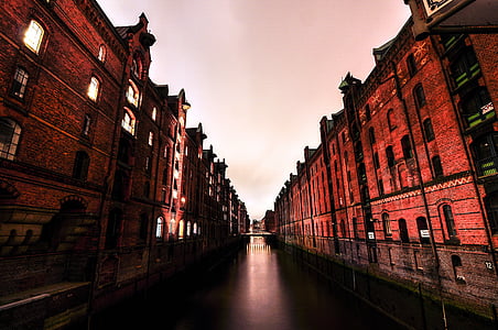 body of water between orange buildings thumbnail