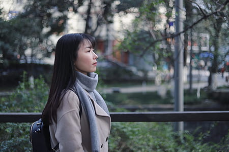 woman standing while facing right side outdoors thumbnail