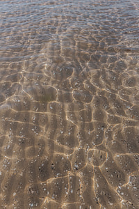 Soft wave of the sea on the sandy beach thumbnail