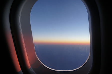 silhouette photo of airplane window thumbnail