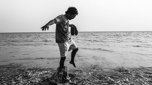 Man on Top of Body of Water Grayscale Photography thumbnail