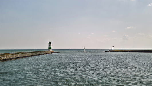 body of water and light house thumbnail