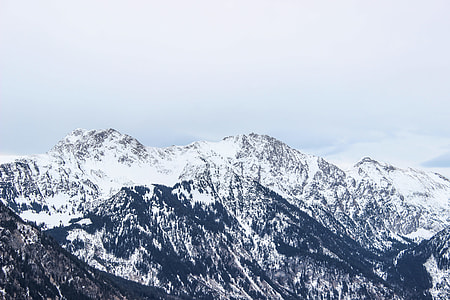 mountain peak covered by snow during daytime thumbnail